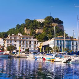 Denia Port with castle hill and marina boats in Alicante province Spain