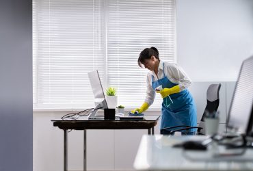 Janitor Cleaning Office Desk. Hygiene Cleaner Service