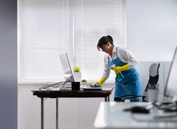 Janitor Cleaning Office Desk. Hygiene Cleaner Service