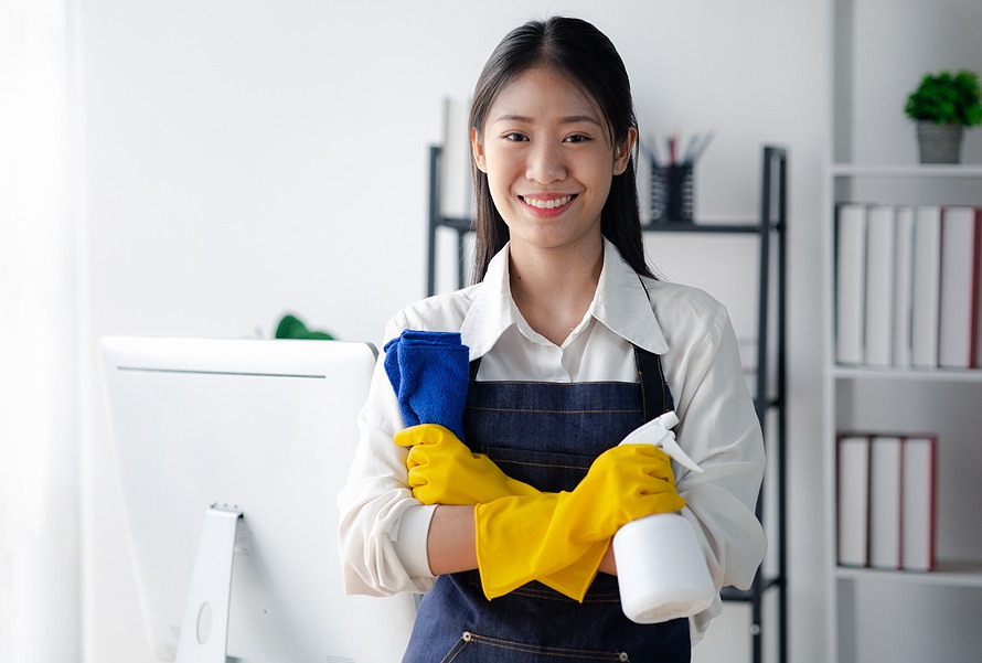 Asian woman cleaning the office, cleaning worker. Maintain cleanliness within the organization. Office disinfection prevents disease outbreaks and maintains hygiene.