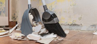 Cleaning Service And Cleaning Of Premises.place The Floor With A Cleaning service and cleaning of premises.Place the floor with a broom after repair.Collect construction debris with a brush in a dustpan.Sweep house.Tools for cleaning the house.Make repairs at home